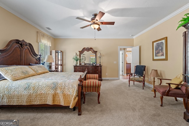 bedroom featuring crown molding, visible vents, baseboards, ceiling fan, and light colored carpet