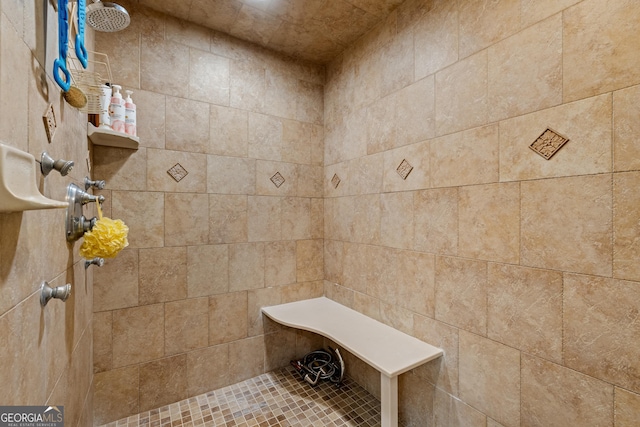 full bathroom with tiled shower