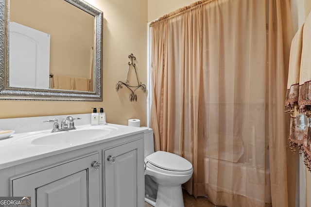 full bath featuring vanity and toilet