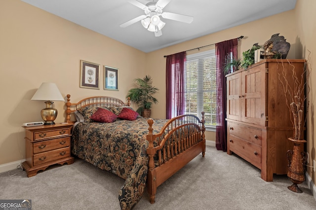 carpeted bedroom featuring a ceiling fan and baseboards