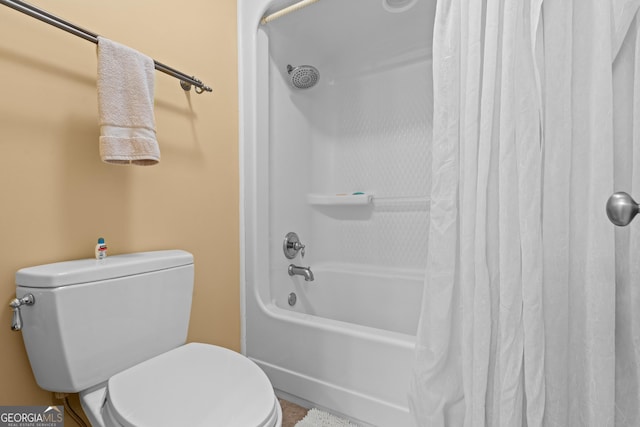 full bathroom featuring shower / bath combination with curtain and toilet