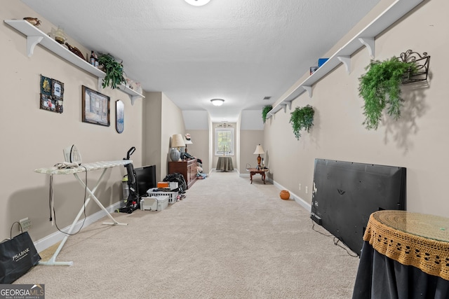 interior space with baseboards and carpet