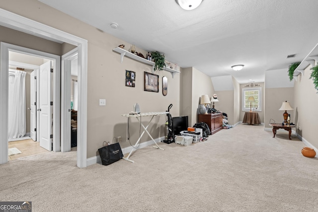 interior space featuring baseboards and carpet flooring