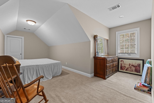 bedroom featuring baseboards, light carpet, vaulted ceiling, and visible vents