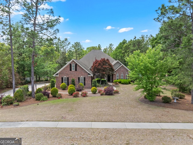 view of front of house with brick siding