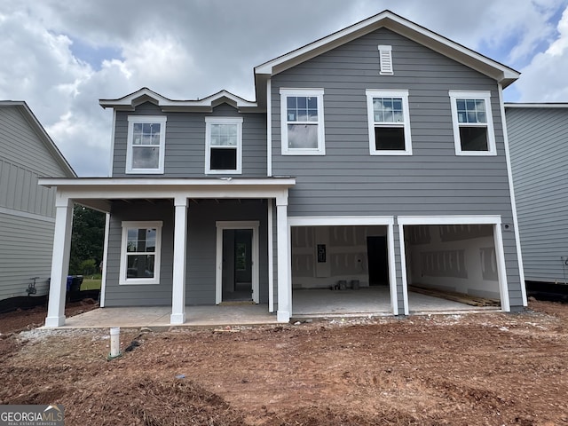 1006 Starmoss Ln, Conyers, GA 30094 - view of front facade with covered porch and an attached garage