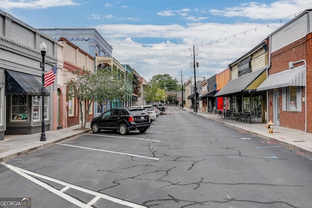 1006 Starmoss Ln, Conyers, GA 30094 - view of road with a residential view, sidewalks, street lighting, and curbs