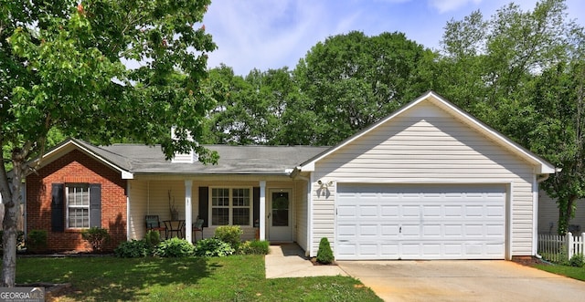 ranch-style house featuring a porch, driveway, a garage, brick siding, and a front lawn