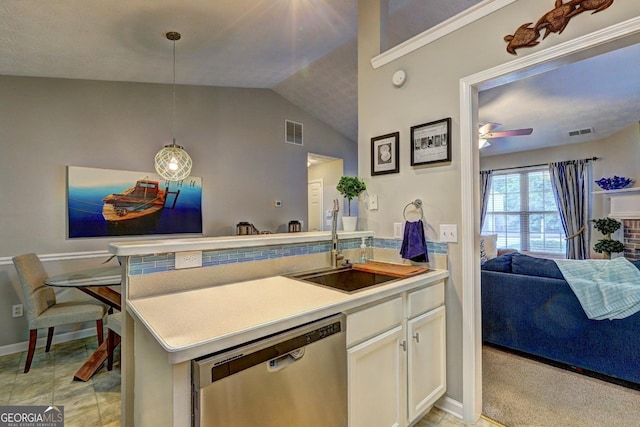 kitchen featuring a sink, visible vents, open floor plan, and dishwasher