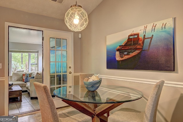 tiled dining area with visible vents