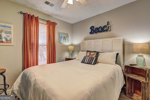 bedroom featuring ceiling fan and visible vents