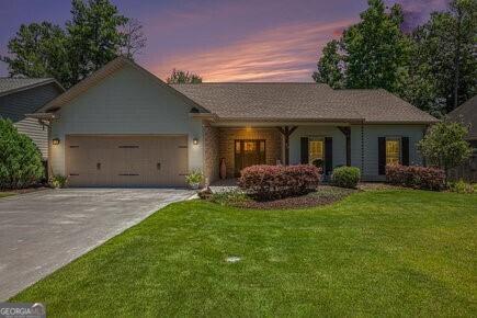 57 Round Rock Cir NE, Rome, GA 30161 - ranch-style home featuring a lawn, driveway, and a garage