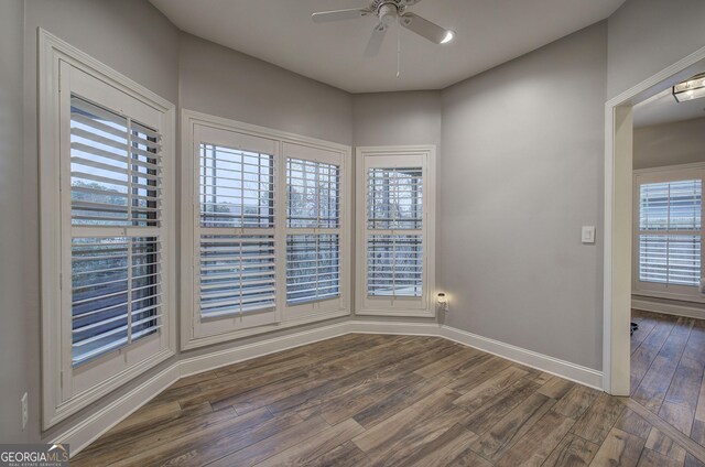57 Round Rock Cir NE, Rome, GA 30161 - spare room with baseboards, a ceiling fan, and dark wood finished floors