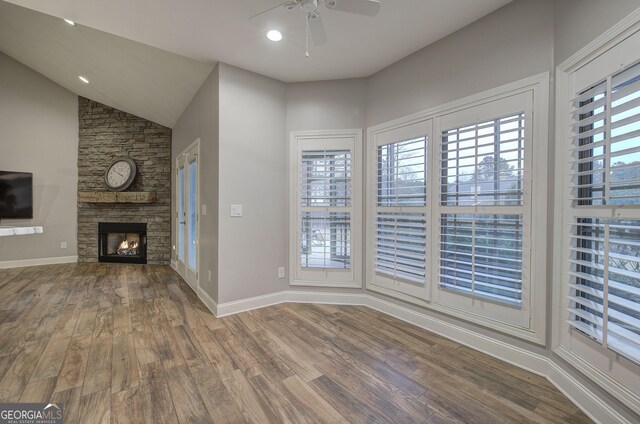 57 Round Rock Cir NE, Rome, GA 30161 - unfurnished living room with ceiling fan, a fireplace, wood finished floors, baseboards, and lofted ceiling