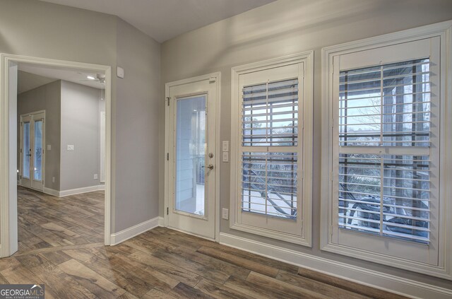 57 Round Rock Cir NE, Rome, GA 30161 - doorway with baseboards and dark wood-type flooring