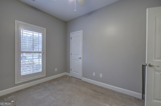 57 Round Rock Cir NE, Rome, GA 30161 - spare room featuring a ceiling fan, baseboards, and light colored carpet