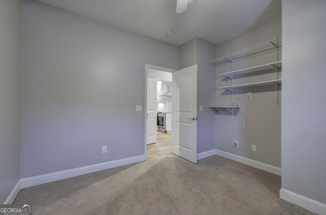57 Round Rock Cir NE, Rome, GA 30161 - unfurnished bedroom with baseboards, carpet flooring, and ceiling fan
