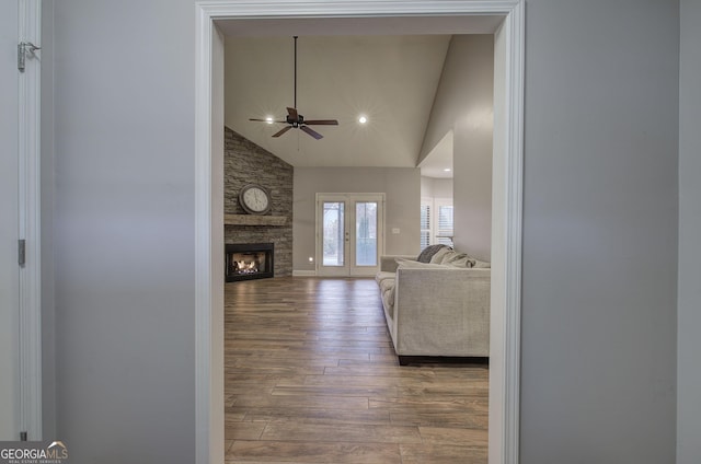 57 Round Rock Cir NE, Rome, GA 30161 - living room featuring ceiling fan, a stone fireplace, wood finished floors, high vaulted ceiling, and recessed lighting