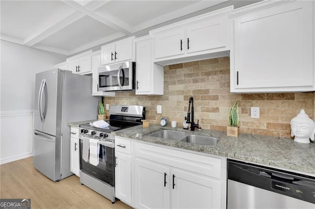 1839 Belcher Pl, Austell, GA 30168 - kitchen with a sink, light stone countertops, stainless steel appliances, and white cabinetry