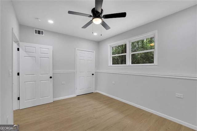 1839 Belcher Pl, Austell, GA 30168 - unfurnished bedroom with visible vents, recessed lighting, light wood finished floors, and baseboards
