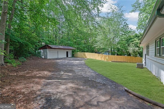 1839 Belcher Pl, Austell, GA 30168 - view of yard featuring fence, an outdoor structure, and cooling unit