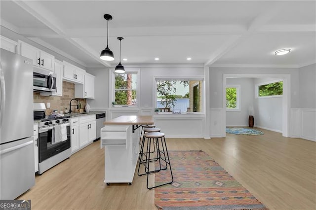 1839 Belcher Pl, Austell, GA 30168 - kitchen with beam ceiling, appliances with stainless steel finishes, a sink, and coffered ceiling