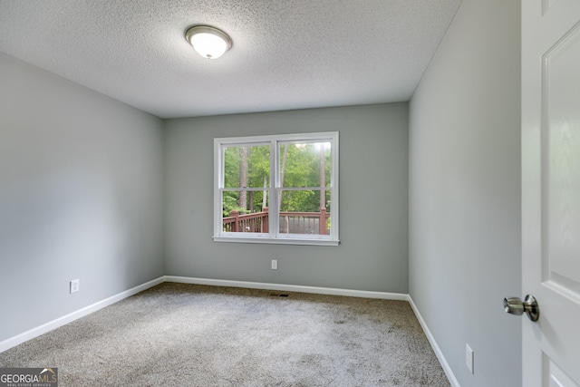 1094 Plantation Ct, Villa Rica, GA 30180 - carpeted spare room featuring baseboards, a textured ceiling, and visible vents