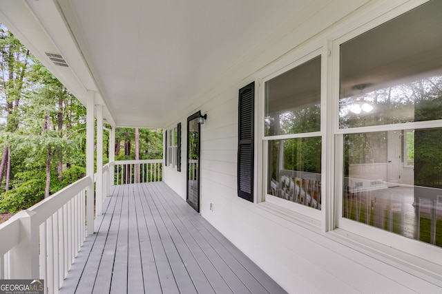 1094 Plantation Ct, Villa Rica, GA 30180 - wooden deck with covered porch and visible vents
