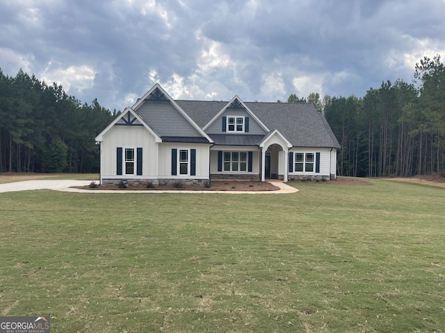 788 Traveler Ln, Williamson, GA 30292 - craftsman-style house with a view of trees, a front lawn, and board and batten siding