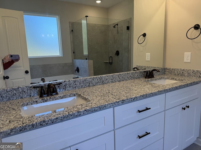 788 Traveler Ln, Williamson, GA 30292 - full bathroom with double vanity, a sink, a bath, and a shower stall