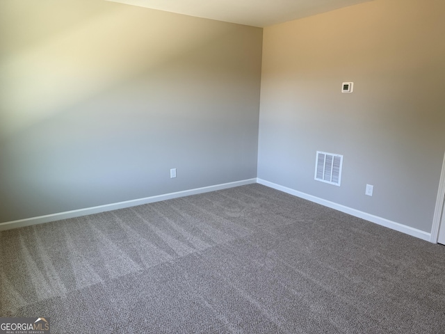 788 Traveler Ln, Williamson, GA 30292 - empty room with baseboards, visible vents, and dark carpet