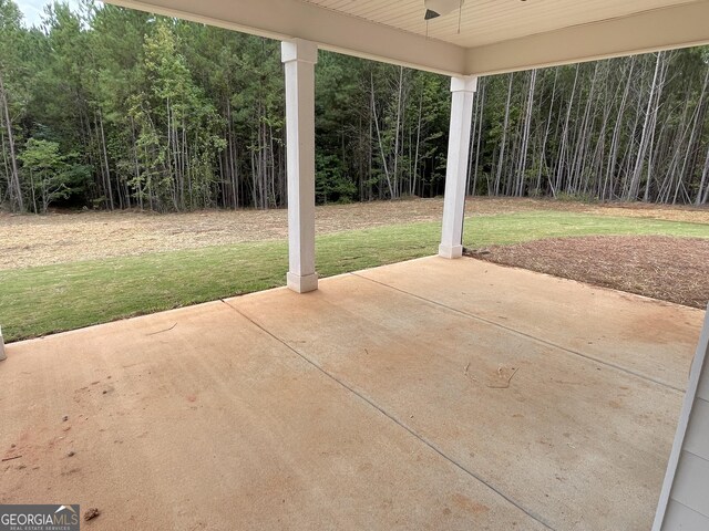 788 Traveler Ln, Williamson, GA 30292 - view of patio / terrace with a view of trees and ceiling fan