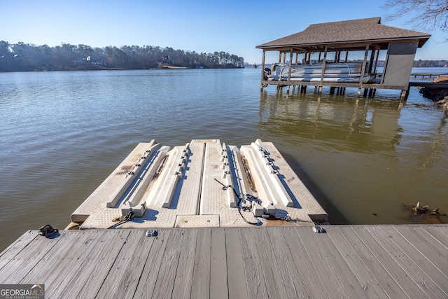 dock area featuring a water view and boat lift