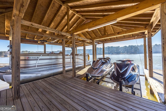 dock area featuring a water view and boat lift