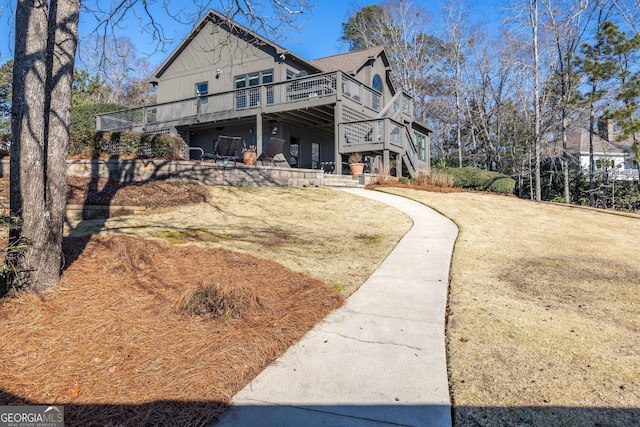 view of front facade with a wooden deck