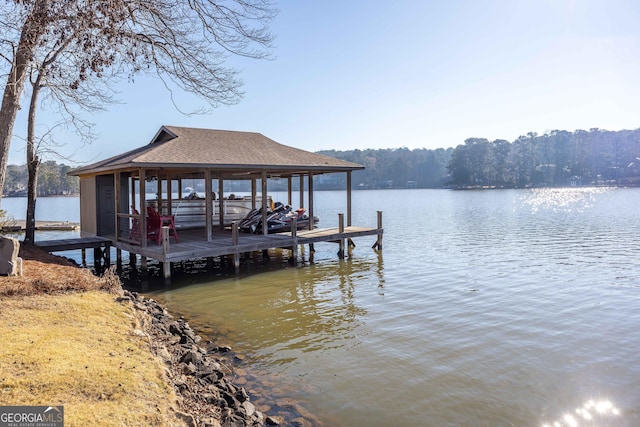 view of dock featuring a water view and boat lift