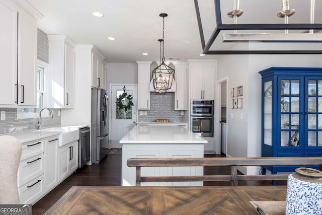 302 Odom Dr, Hamilton, GA 31811 - kitchen with stainless steel appliances, a sink, a chandelier, tasteful backsplash, and recessed lighting