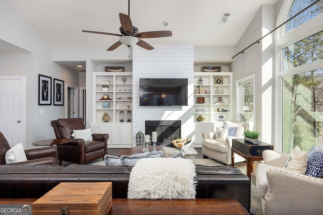 302 Odom Dr, Hamilton, GA 31811 - living room featuring ceiling fan and a large fireplace