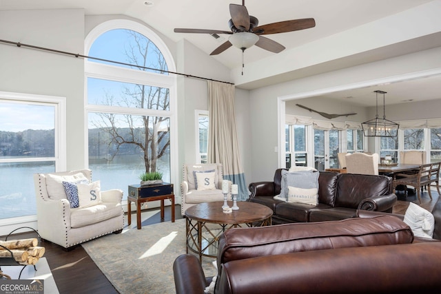 302 Odom Dr, Hamilton, GA 31811 - living room featuring vaulted ceiling, wood finished floors, a ceiling fan, and a water view