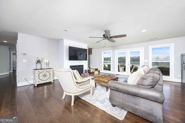 302 Odom Dr, Hamilton, GA 31811 - living area featuring a ceiling fan, a fireplace, healthy amount of natural light, wood finished floors, and recessed lighting