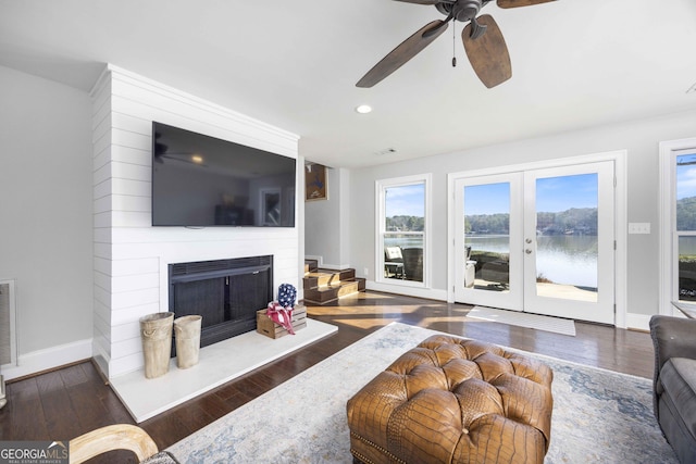 302 Odom Dr, Hamilton, GA 31811 - living area with wood finished floors, a ceiling fan, a large fireplace, baseboards, and recessed lighting