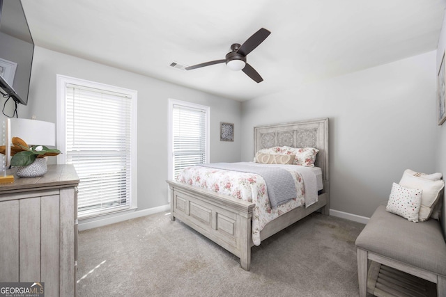 302 Odom Dr, Hamilton, GA 31811 - bedroom featuring carpet floors, baseboards, and ceiling fan