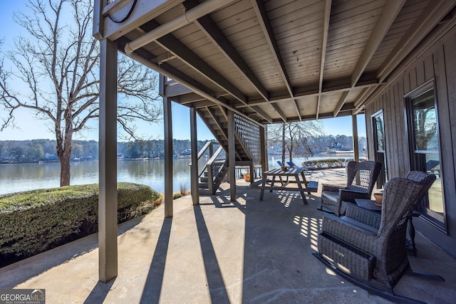 302 Odom Dr, Hamilton, GA 31811 - view of patio / terrace with stairway and a water view