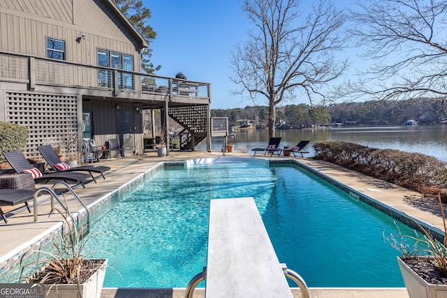 302 Odom Dr, Hamilton, GA 31811 - swimming pool featuring stairway, a diving board, a deck with water view, and a patio