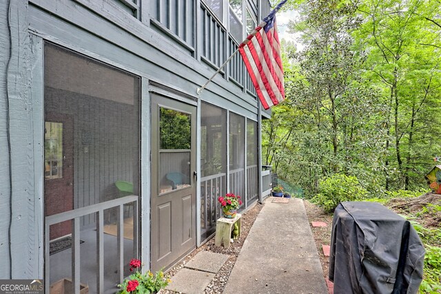 view of home's exterior featuring a sunroom