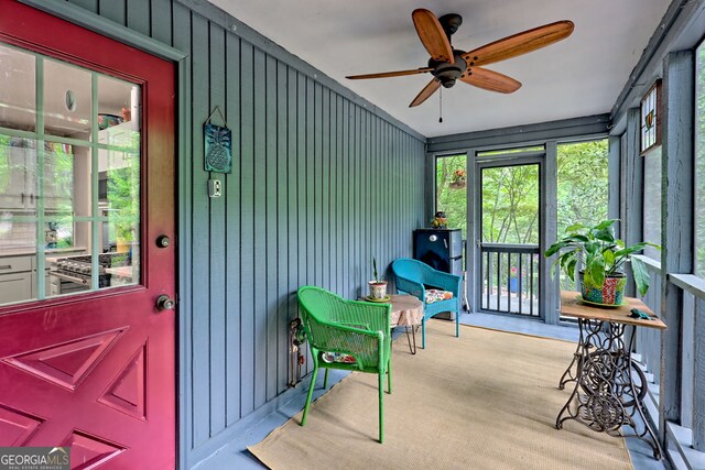 sunroom / solarium with ceiling fan