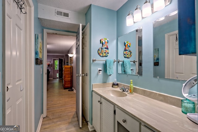 230 Stornoway Dr Unit 1, Clayton, GA 30525 - bathroom with wood finished floors and vanity