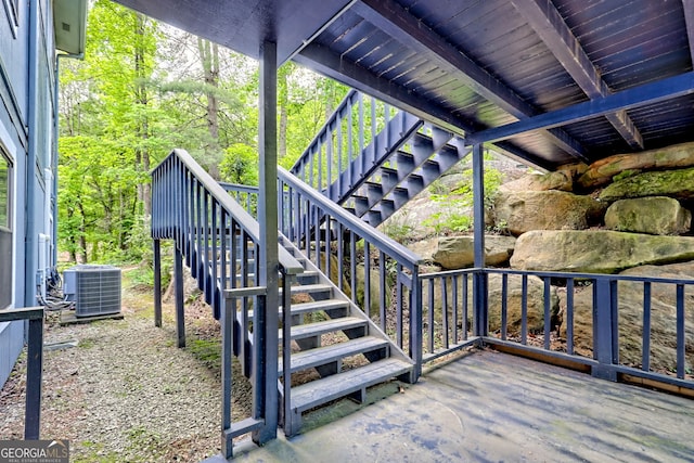 deck with stairway and central AC