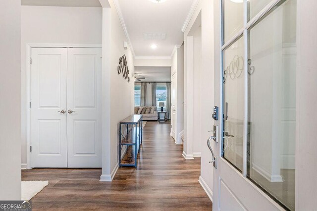 112 Leveret Rd, Locust Grove, GA 30248 - corridor featuring baseboards, ornamental molding, wood finished floors, and visible vents