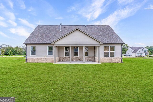 112 Leveret Rd, Locust Grove, GA 30248 - back of property with a yard, a patio, and a shingled roof